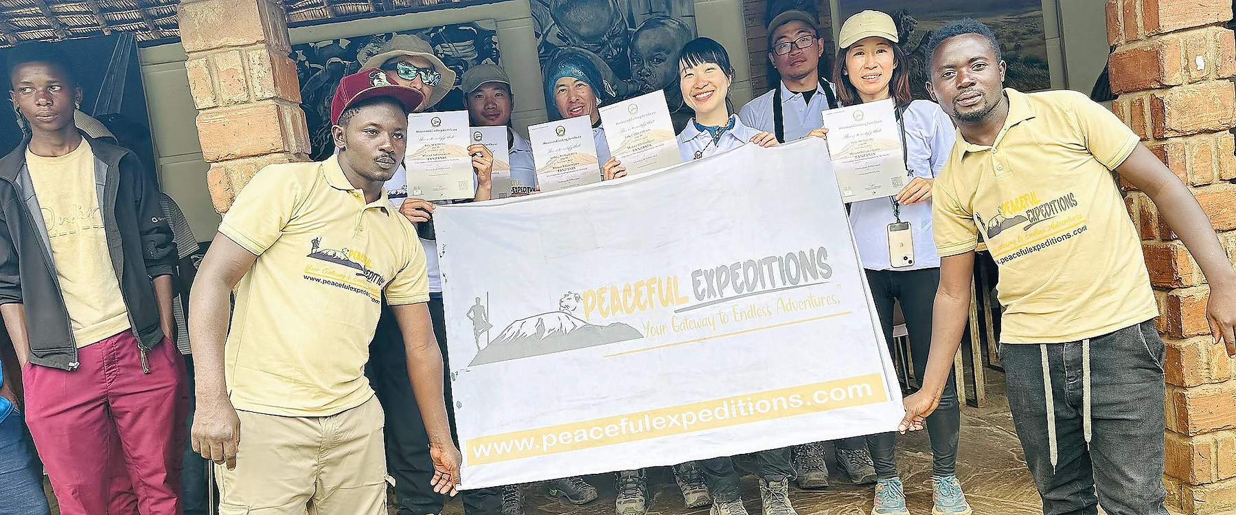Peaceful Expeditions team with company banner